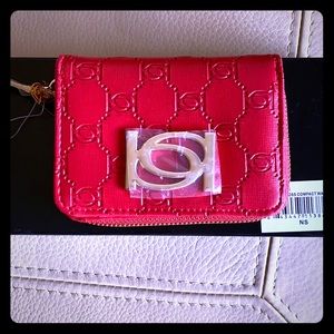 Red or Black Bebe compact wallet.